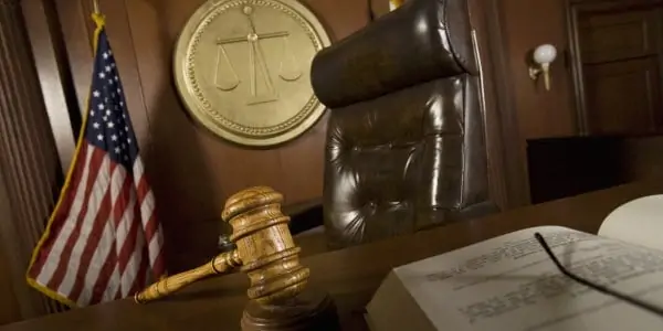 Jodge's chair and gavel to symbolize answer "is real estate wholesaling legal"