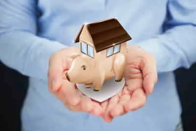 Value - person holding a house in their hands